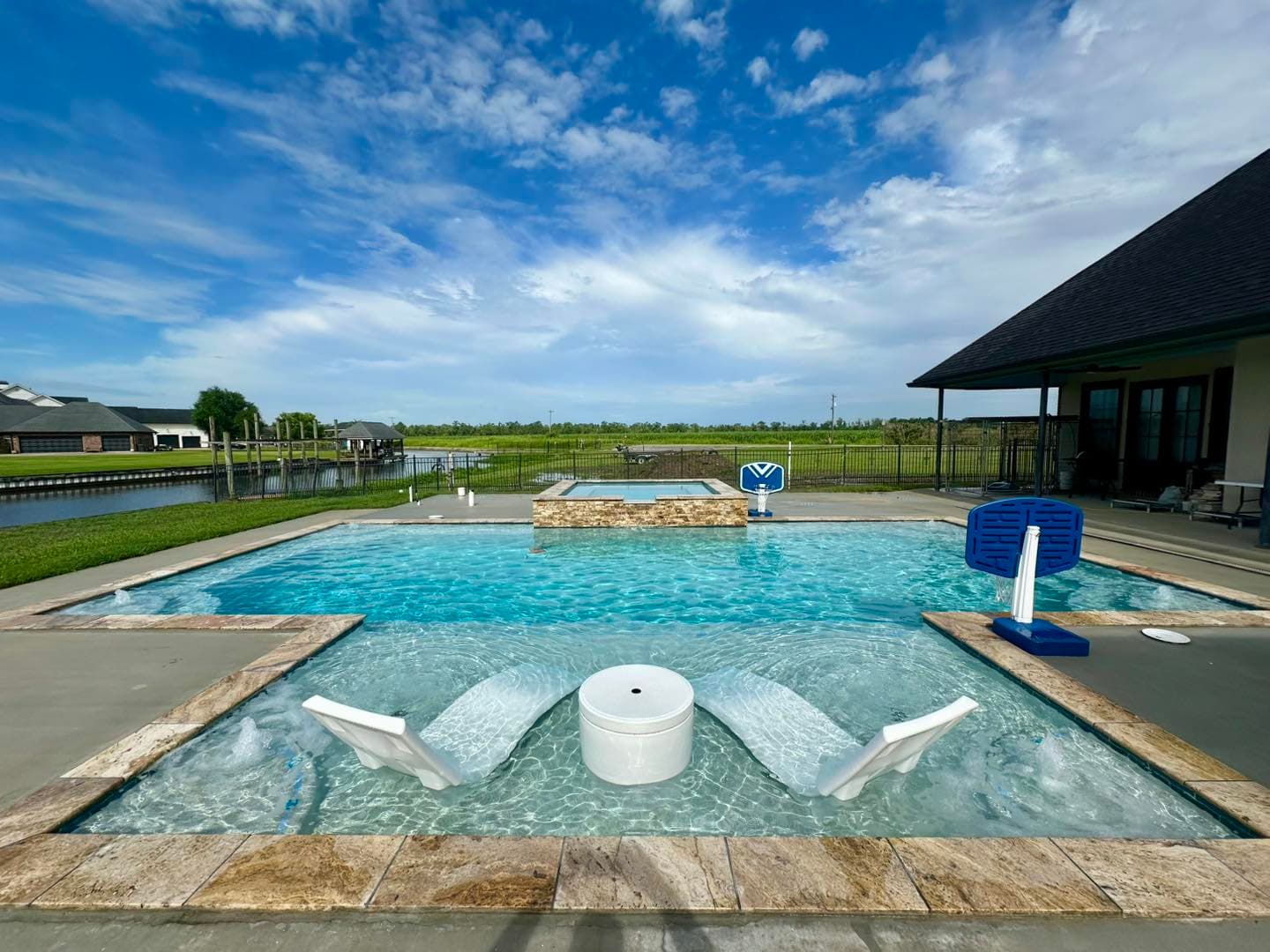 Custom rock waterfall pool feature in Thibodaux
