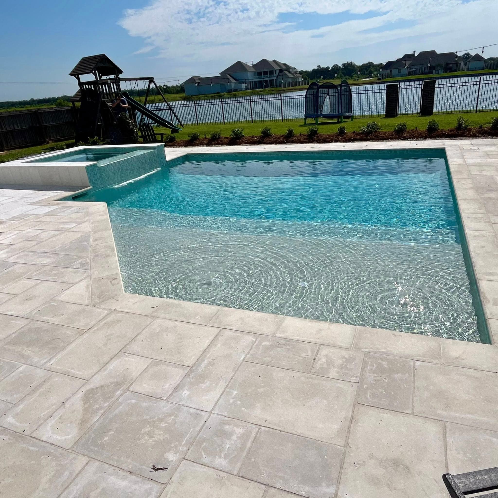 Renovated pool with travertine coping in Thibodaux, LA